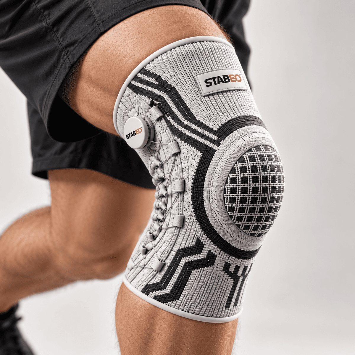 STABEO™ — Genouillère de maintien sportif ajustable